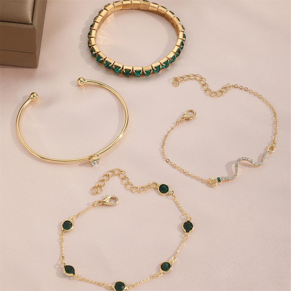 Royal Radiance – 4-Piece Gold Charm Bracelet Set