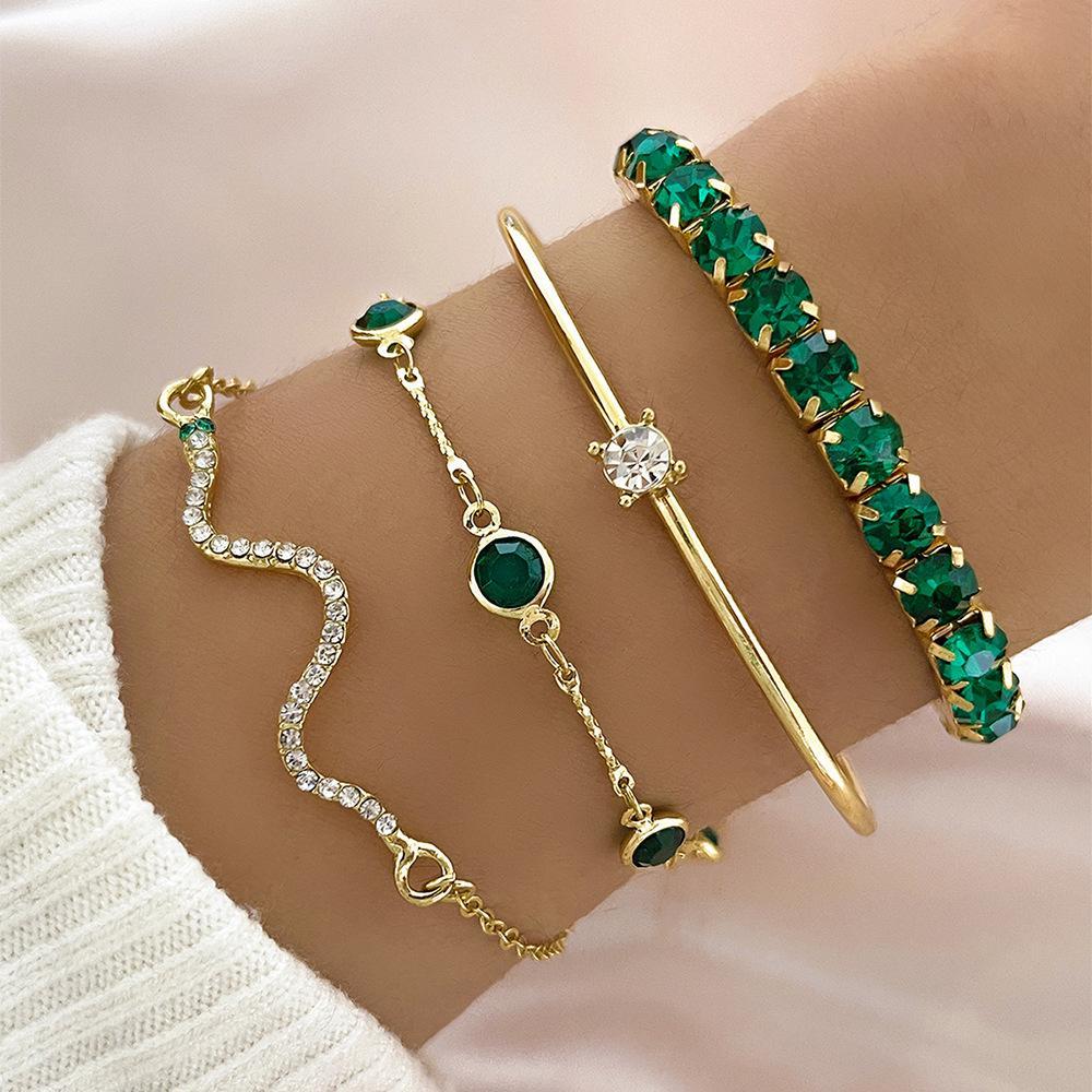 Royal Radiance – 4-Piece Gold Charm Bracelet Set