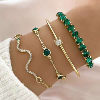 Royal Radiance – 4-Piece Gold Charm Bracelet Set